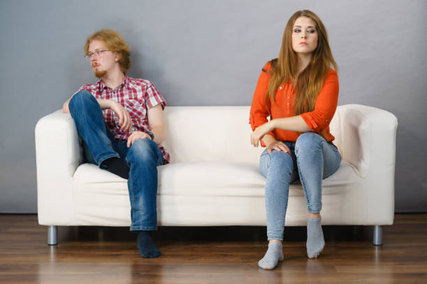 istock Woman and man after argue on sofa 1049934740