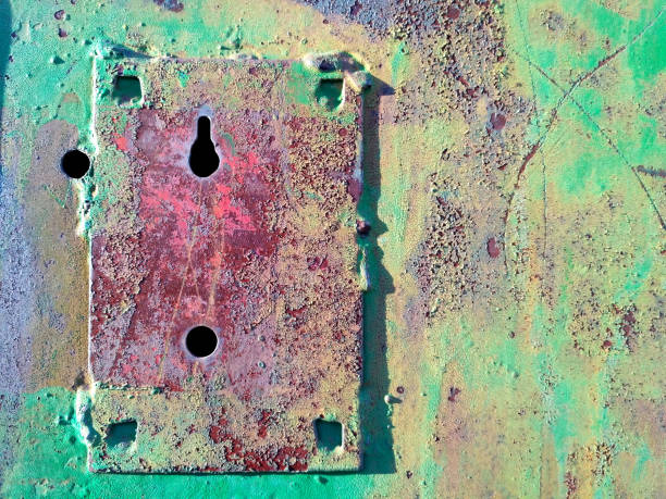 istock Old green painted metal surface with key hole frame 1049934772