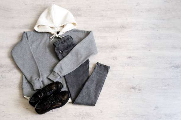 istock Teen clothing set: grey sweatshirt, black jeans and boots in military style 1049934964