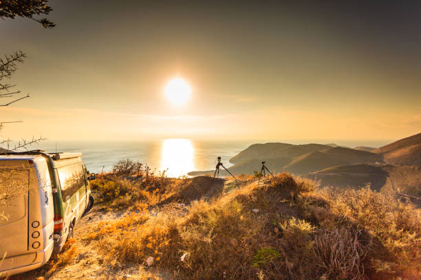 istock Camper car on nature at sunrise. Travel 1049936230