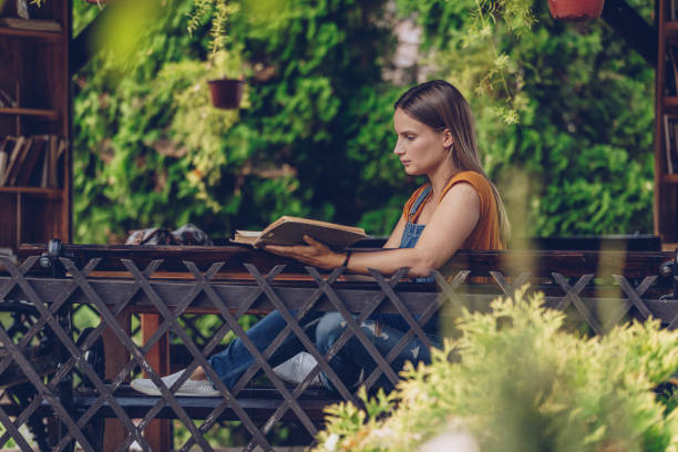 istock Young woman reading 1049938646