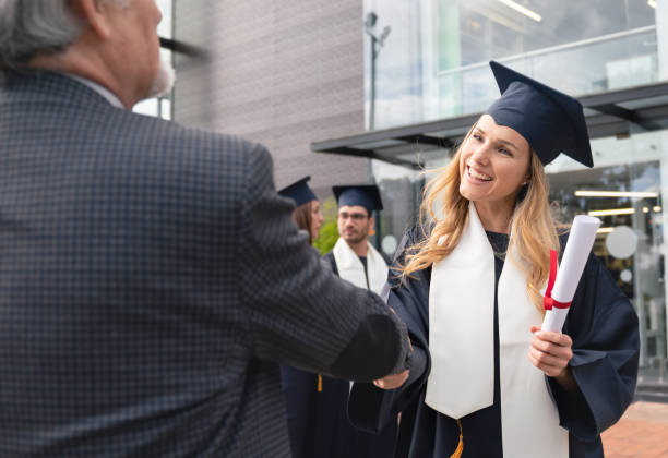 istock Happy female student looking happy getting her diploma 1049942636