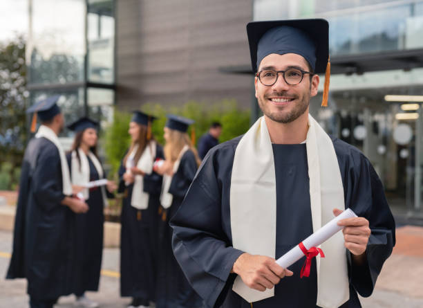istock Male student looking happy on graduation day 1049942690