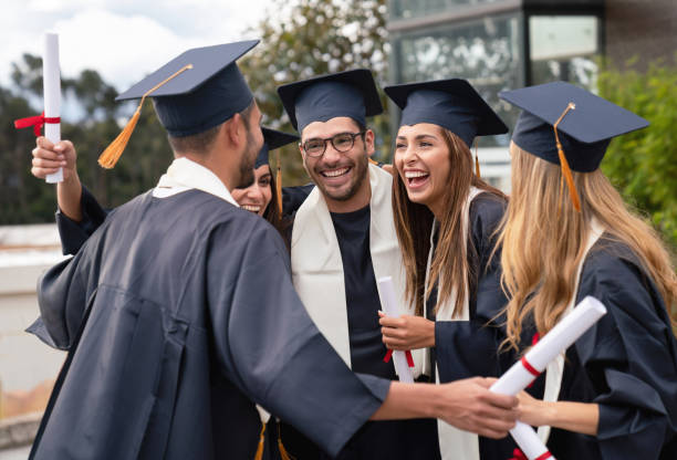 istock Very happy group of graduate students celebrating 1049942708