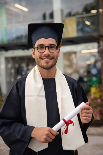 istock Male student looking happy on graduation day 1049942718