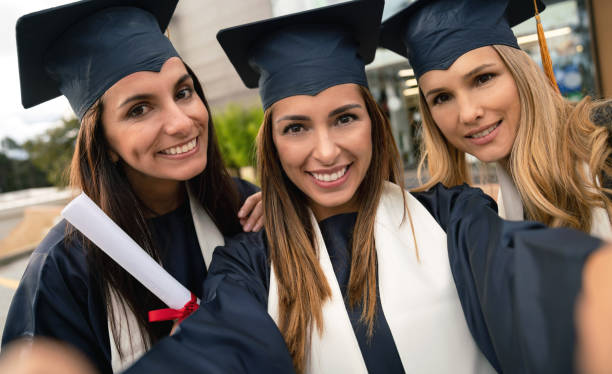 istock Group of graduate students taking a selfie on graduation day 1049942730