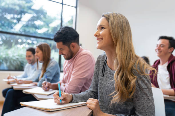 istock Happy group of students in a classroom 1049942746