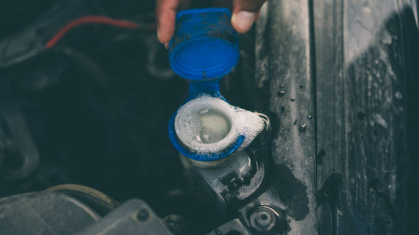istock Man completing the water of his car 1049945538