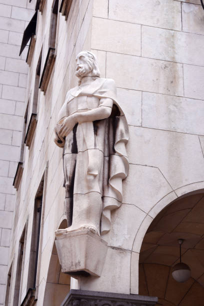 istock Detail on the building. man sculpture.. 1049945686