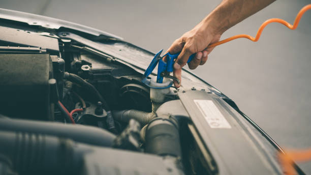 istock Man completing the water of his car 1049945834