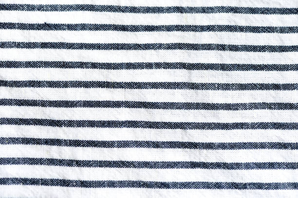 istock Blue and white striped textile background close up 1049949424