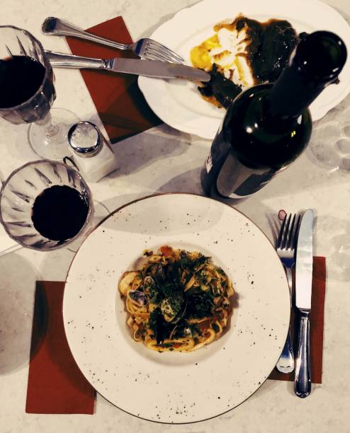 istock Italian dinner table with tagliatelle and red wine 1049952460