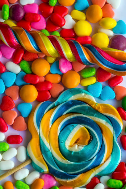 istock Colorful lollipops and different colored round candy. Top view. 1049953730
