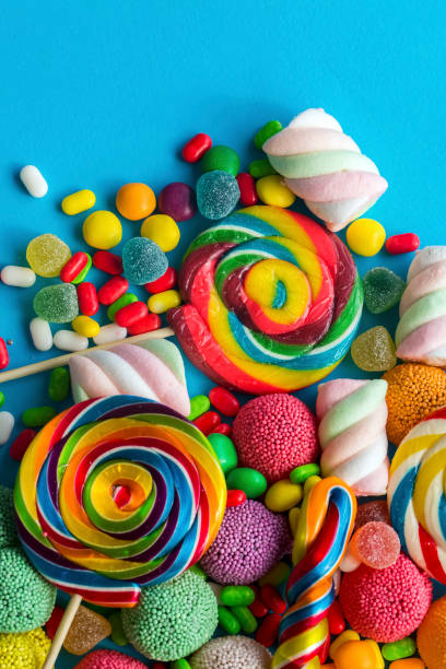istock Colorful lollipops and different colored round candy. Top view. 1049953776