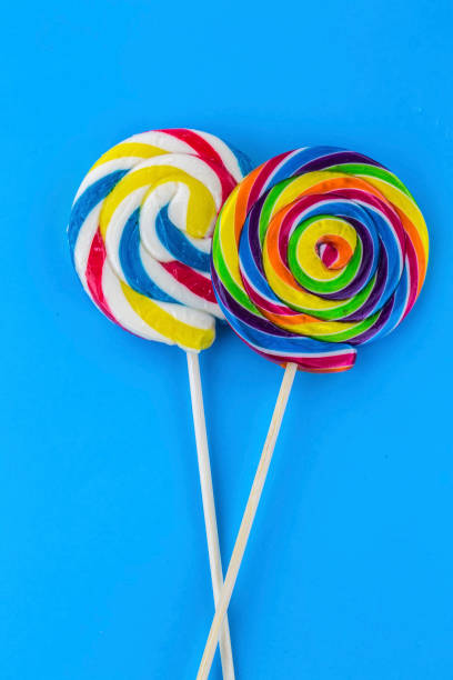 istock Colorful lollipops and different colored round candy. Top view. 1049953858