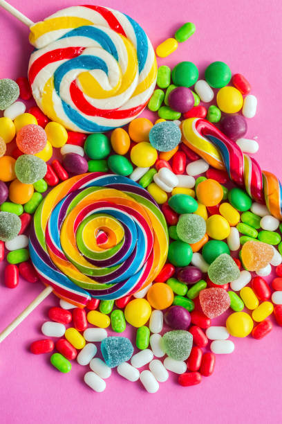 istock Colorful lollipops and different colored round candy. Top view. 1049953872