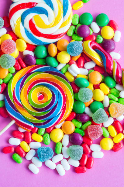 istock Colorful lollipops and different colored round candy. Top view. 1049956038