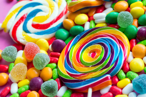 istock Colorful lollipops and different colored round candy. Top view. 1049956108