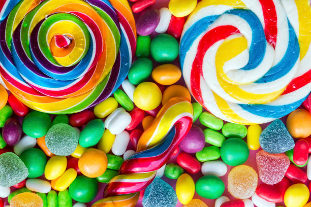 istock Colorful lollipops and different colored round candy. Top view. 1049956116