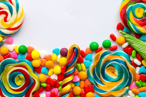 istock Colorful lollipops and different colored round candy. Top view. 1049956154