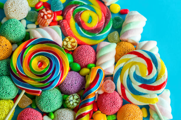 istock Colorful lollipops and different colored round candy. Top view. 1049959322
