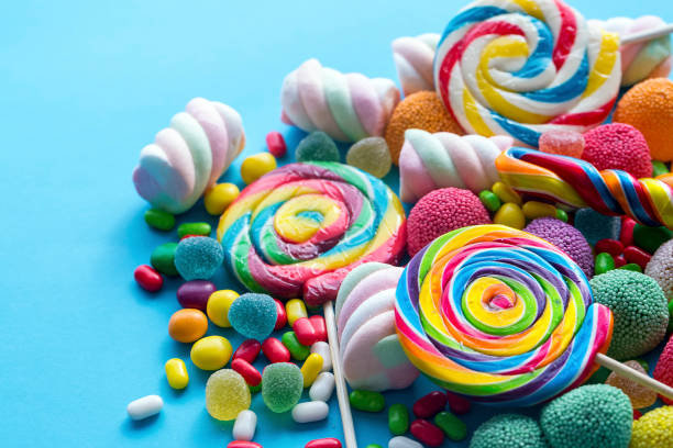 istock Colorful lollipops and different colored round candy. Top view. 1049959326
