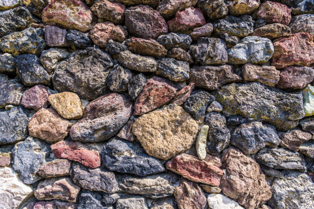 The ancient stone walls of the monastery wall with the inclusion of the wooden beams in the old Greek monastery of the Great Meteora.
