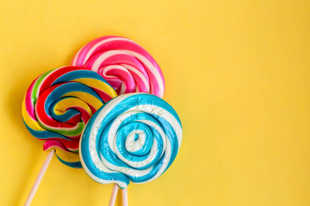 istock Colorful lollipops and different colored round candy. Top view. 1049959462