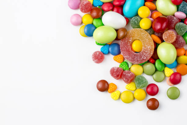 istock Colorful lollipops and different colored round candy. Top view. 1049959572