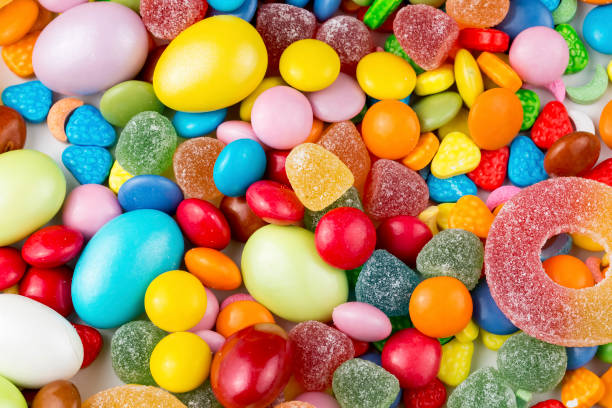 istock Colorful lollipops and different colored round candy. Top view. 1049959758