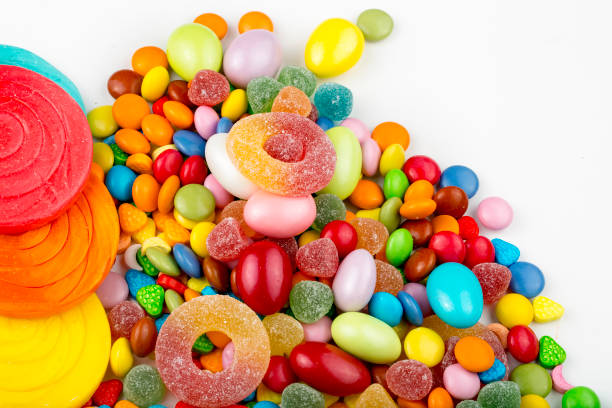 istock Colorful lollipops and different colored round candy. Top view. 1049959960
