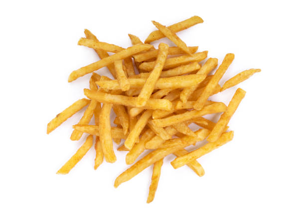Top view of a pile of cooked french fries Top view of a pile of cooked french fries isolated on a white background. french fries stock pictures, royalty-free photos & images
