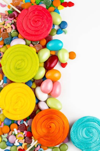 istock Colorful lollipops and different colored round candy. Top view. 1049960308