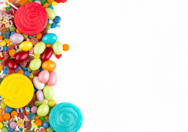 istock Colorful lollipops and different colored round candy. Top view. 1049960328