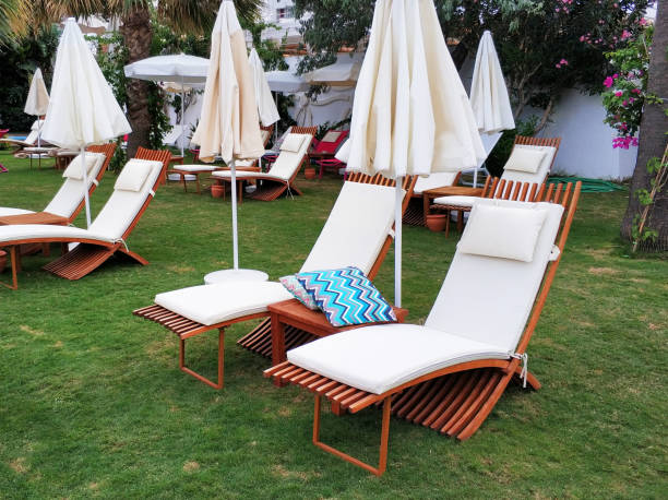 istock Lounge chairs in hotel garden 1049964164