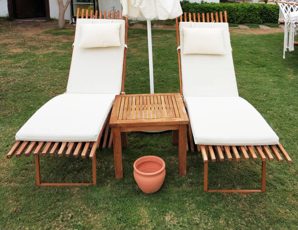 istock Lounge chairs in hotel garden 1049966196