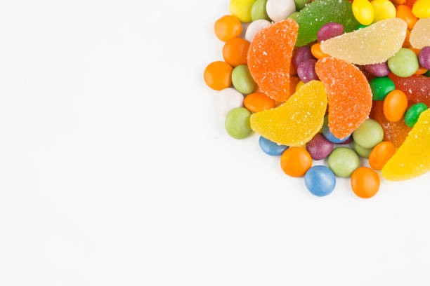 istock Colorful lollipops and different colored round candy. Top view. 1049969316