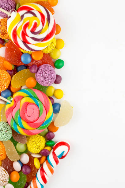 istock Colorful lollipops and different colored round candy. Top view. 1049969346