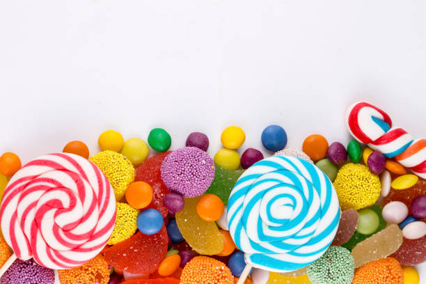 istock Colorful lollipops and different colored round candy. Top view. 1049969432