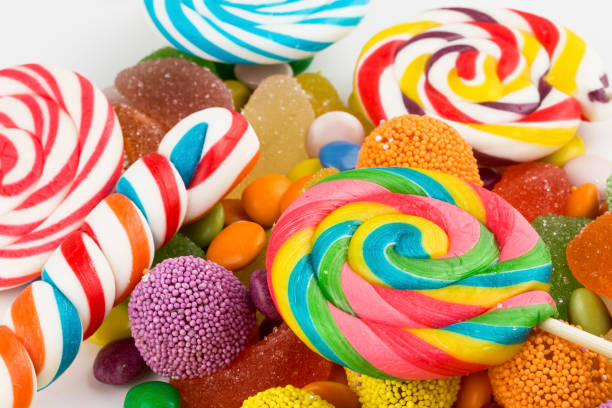 istock Colorful lollipops and different colored round candy. Top view. 1049969436