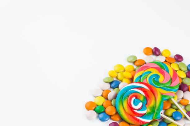 istock Colorful lollipops and different colored round candy. Top view. 1049969450