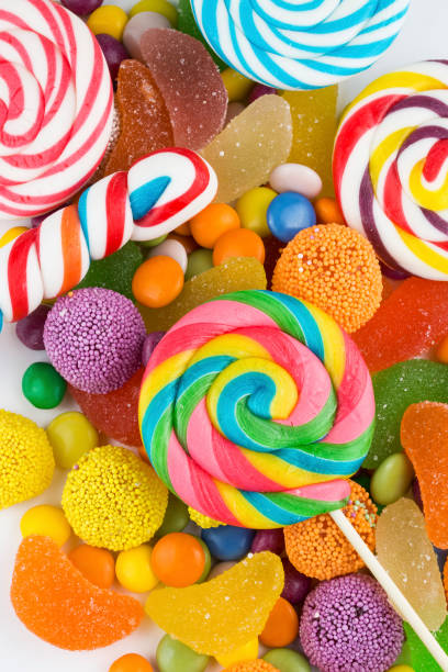 istock Colorful lollipops and different colored round candy. Top view. 1049969484