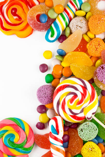 istock Colorful lollipops and different colored round candy. Top view. 1049969512