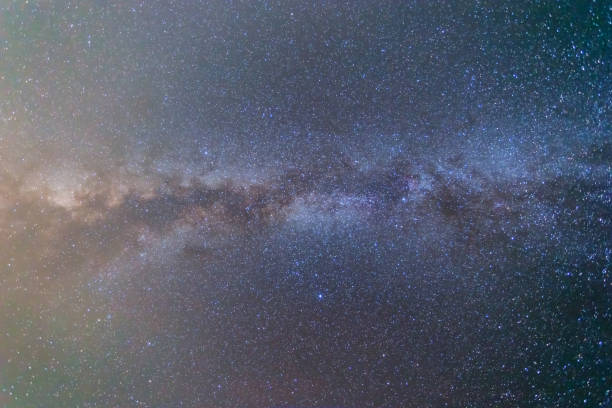 istock night  dark starry sky with milky way, nature background 1049969730