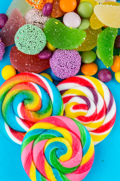 istock Colorful lollipops and different colored round candy. Top view. 1049969788