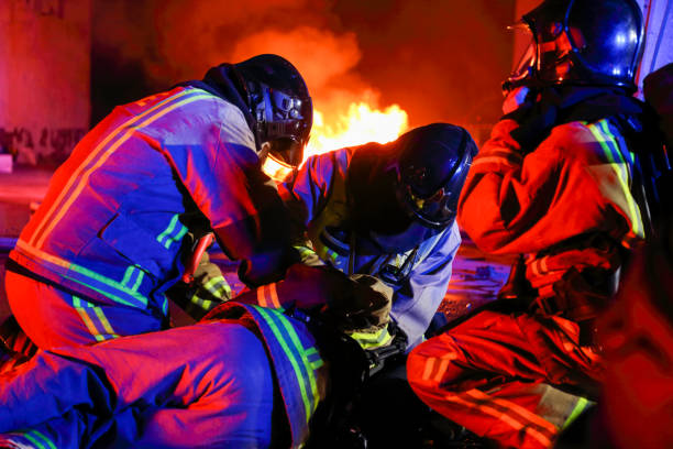 istock Firefighters helping their injured friend 1049969946