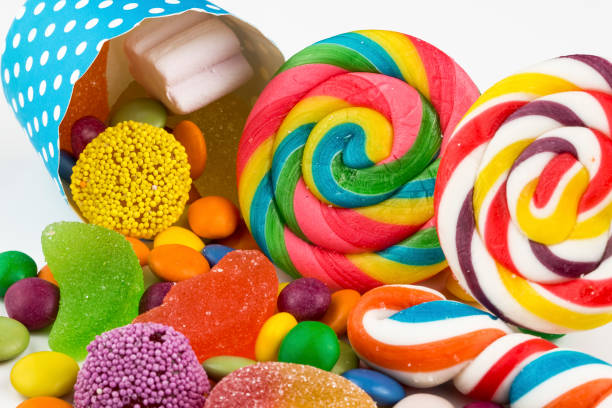 istock Colorful lollipops and different colored round candy. Top view. 1049969954