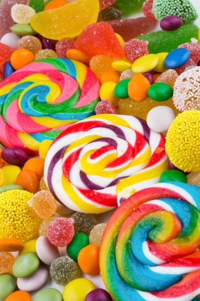 istock Colorful lollipops and different colored round candy. Top view. 1049970034
