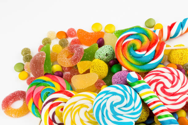 istock Colorful lollipops and different colored round candy. Top view. 1049970090