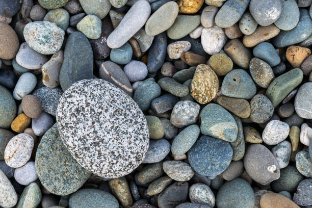 istock Background with different color sea stones 1049973060